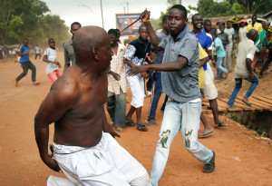 Man chases a suspected Seleka member  Image courtesy of The Atlantic 