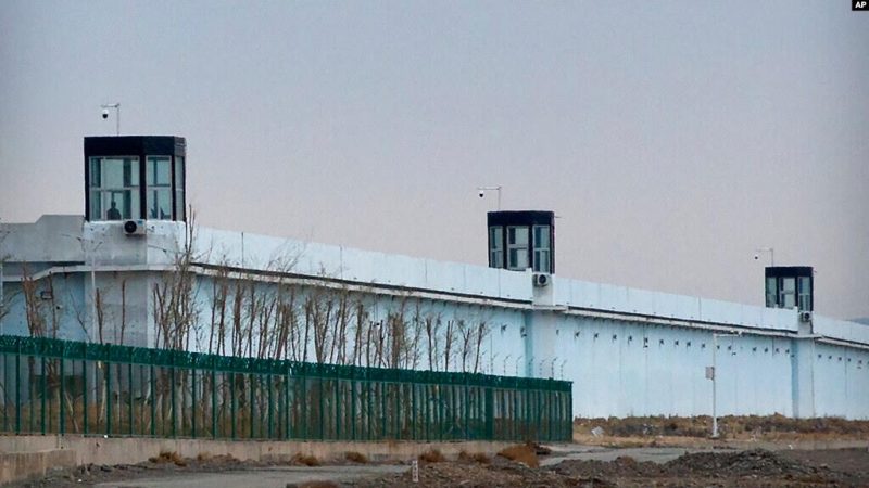 A person stands in a tower on the perimeter of the No. 3 Detention Center in Dabancheng in western China's Xinjiang Uyghur Autonomous Region on April 23, 2021.
